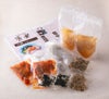 「芳華冷麺」の麺、スープ、具材、作り方が個別にパックに詰められた内容量画像。ご自宅で本格的な冷麺を簡単に楽しめるお取り寄せセット。