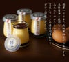 「みたらし醤油屋プリン」の容器を背景に、こだわり素材、窯蒸し製法が記載された本格的な画像。
